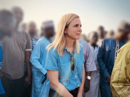 Mariana van Zeller stands amongst a group of surrendered Boko Haram fighters at a de-radicalization camp. (Credit: National Geographic)
