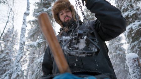 Chevie Roach checks his marten and small fur animal trap sets. (BBC Studios/Brian Bitterfeld)