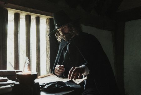 Matthew Hopkins sits at his table studying a map. (Dash Productions Services LTD/Antoan Ivanov)