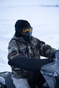 Qutan Hailstone glasses the tundra for caribou during a herd migration.(BBC Studios Reality Productions, LLC/Ashton Hurlburt)