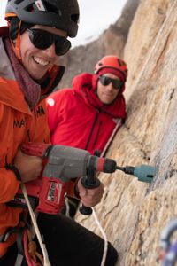 Heidi Sevestre, left, and Alex Honnold drilling rock samples on the Pool Wall.  (photo credit: National Geographic/Mikey Schaefer)