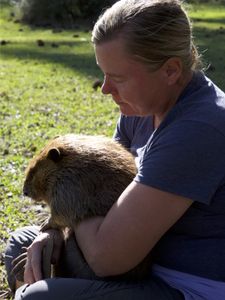 Holly holding a beaver. (Big Wave Productions)