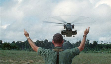A military air traffic controller directs a helicopter landing in Guyana. (National Archives and Records Administration)