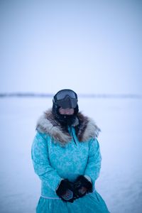 Qutan Hailstone ice fishing with her family. (BBC Studios Reality Productions, LLC/Pedro Delbrey)