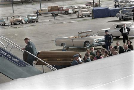 This colorized archival image shows President John F. Kennedy's casket as it is carried onto Air Force One at Love Field, Dallas, Nov. 22, 1963. Onlookers include Lawrence O'Brien, General Clifton, Jacqueline Kennedy, Kenneth O'Donnell, Dave Powers, and Evelyn Lincoln. (Cecil Stoughton/White House Photographs/John F. Kennedy Presidential Library and Museum, Boston)