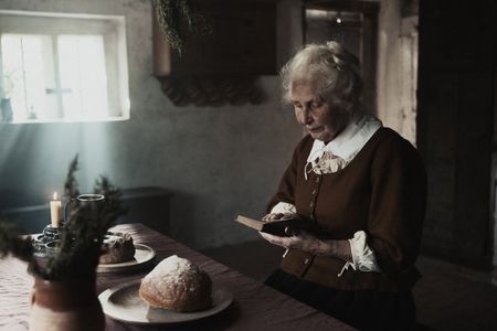 Ann Haltridge sits in a kitchen and reads a book. (Dash Productions Services LTD/Antoan Ivanov)