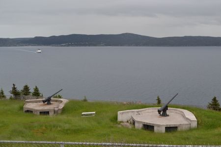 Coastal defense guns on Bell Island, Canada. MYSTERIOUS ISLANDS takes viewers on an unforgettable adventure to explore the most extraordinary and enigmatic islands on the planet. (Credit: Small Town Canada/Shandi Pace)