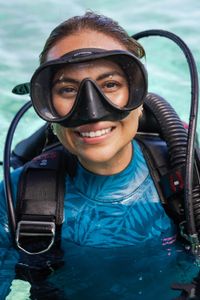Dr. Alex Schnell in full SCUBA gear, ready to dive with a Day octopus on the Great Barrier Reef.  (National Geographic for Disney/Harriet Spark)