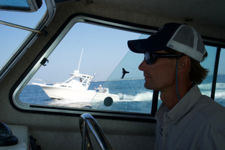 Capt. Greg Metzger and the team are joined by another fishing boat. They are heading out to sea together to maximize their chances of catching a baby white shark. (National Geographic/Brandon Sargeant)