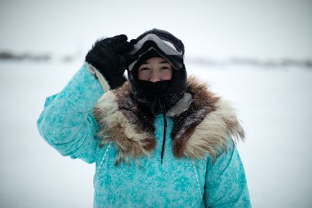 Qutan Hailstone ice fishing with her family. (BBC Studios Reality Productions, LLC/Pedro Delbrey)