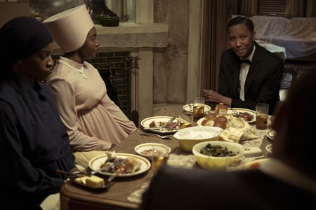 Ella Mae, played by Ashley Romans, and Betty, played by Jayme Lawson, have dinner with Elijah Muhammad, played by Ron Cephas Jones, GENIUS: MLK/X. (National Geographic/Richard DuCree)