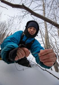 Denise Becker sets rabbit snares for food. (BBC Studios Reality Productions/Ben Mullin)