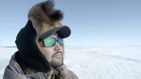 Avery Hoffman ice fishing with his family in freezing temperatures.(BBC Studios Reality Productions, LLC/Brian Bitterfeld)