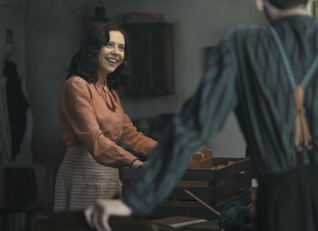 A SMALL LIGHT - Miep Gies, played by Bel Powley, delivers a surprise of fresh strawberries to the annex as seen in A SMALL LIGHT. (Credit: National Geographic for Disney/Martin Mlaka)