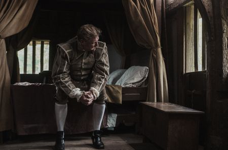 Dietrich Flade under house arrest, sat on the edge of his bed, pensively looking out of the bedroom window. (Dash Productions Services LTD/Antoan Ivanov)