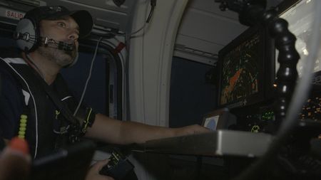 A guard monitors from a helicopter in Cadiz, Spain. (National Geographic)