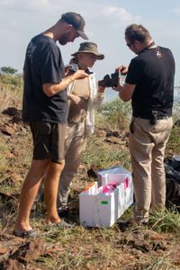 Drone Operator Adam Clarke, Researcher Maia Sherwood-Rogers, and Drone Operator Craig Cleave readying the Rocrow in preparation for filming flamingos. (National Geographic for Disney/Sally Thomson)