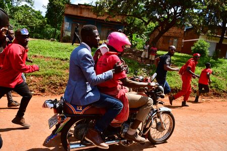Bobi Wine decides to travel to a campaign location in Kayunga District by motorbike. The Ugandan security vehicles had previously prevented his cars from entering the venue on December 1, 2020.  (photo credit: Lookman Kampala)