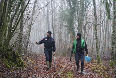 Guy Mom per and Florian Drosne from the Metz demining center and Alex Churchill walk through the "Red Zone" forest near Verdun, France. An area where an estimated 8 million shells fell without exploding during WW1. Many shells still remain untouched in the forest. (National Geographic/Ciaran Henry)