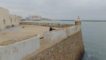 Claudio Lozano looks out from Castillo de Santa Catalina in C·diz, Spain. (National Geographic)