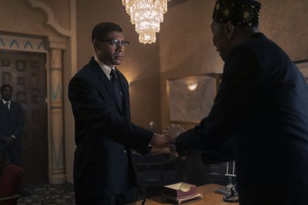 Malcolm X, played by Aaron Pierre, greets Elijah Muhammad, played by Ron Cephas Jones, in GENIUS: MLK/X. (National Geographic/Richard DuCree)