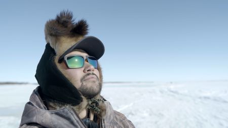 Avery Hoffman ice fishing with his family in freezing temperatures.(BBC Studios Reality Productions, LLC/Brian Bitterfeld)