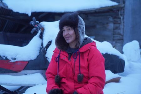 Agnes Hailstone making grass matts with her family that they'll use while ice fishing. (BBC Studios Reality Productions, LLC/Dwayne Fowler)