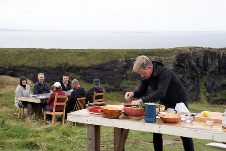 Gordon Ramsay puts finishing touches on his dishes while his guests wait. (National Geographic/Justin Mandel)