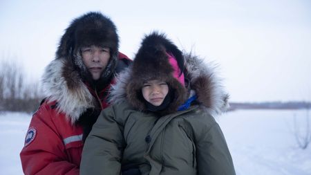 Ricko DeWilde with his son, Keenan DeWilde setting marten traps in winter. (BBC Studios Reality Productions, LLC/Pedro Delbrey)