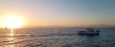 A boat sails during sunset in Ibiza, Balearic Islands. Spain. (National Geographic/Jose Antonio Gavilán Tobal)