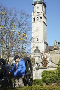 Tony Pollard inspects a replica cannon at Jasna Gora Monastery, Poland.  Jasna Gora Monastery, Poland. In 1655 the monastery defended itself against an onslaught from the Swedish army.  (National Geographic/Ciaran Henry)