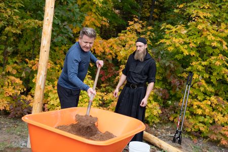 Michigan - L to R: Gordon Ramsay and Father Ephrem install a fence at a monastery in the Upper Peninsula of Michigan. (Credit: National Geographic/Justin Mandel)