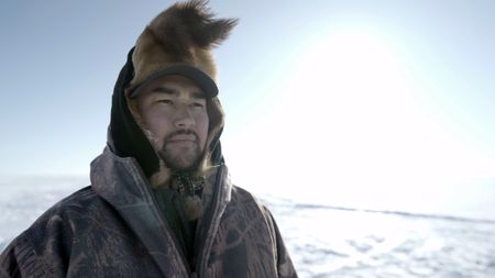 Avery Hoffman ice fishing with his family in freezing temperatures.(BBC Studios Reality Productions, LLC/Brian Bitterfeld)