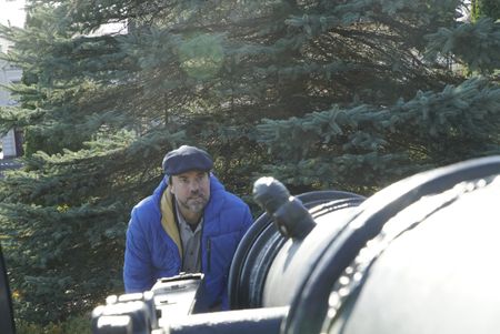 Tony Pollard inspects a replica cannon at Jasna Gora Monastery, Poland.  Jasna Gora Monastery, Poland. In 1655 the monastery defended itself against an onslaught from the Swedish army.  (National Geographic/Ciaran Henry)