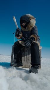 Jaxon Hoffman ice fishing with his family. (BBC Studios Reality Productions, LLC/Brian Bitterfeld)