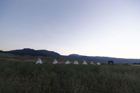 A row of teepees in front of the roosevelt arch.  (National Geographic/Jeff Reed)