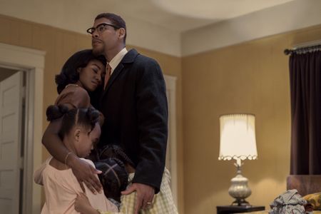 Betty Shabazz, played by Jayme Lawson, and Malcolm X, played by Aaron Pierre, embrace with their children in GENIUS: MLK/X. (National Geographic/Richard DuCree)