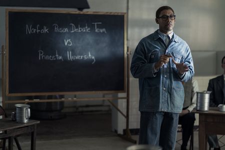 Malcolm X, played by Aaron Pierre, speaks during a debate from prison as seen in GENIUS: MLK/X. (National Geographic/Richard DuCree)