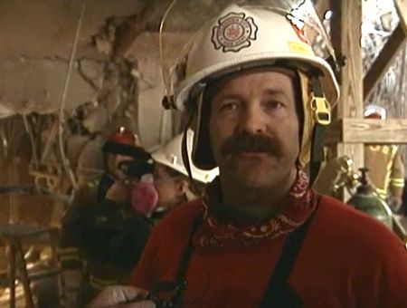 District Fire Chief Mike Shannon gives a press update from inside the Alfred P. Murrah Federal Building in April 1995. (National Geographic)