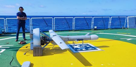 A tax agency staff member observes the surveillance drone. (National Geographic/José Ramón Sanz)