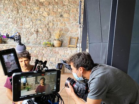 Gerd Serrasolses is interviewed in Sort, Spain. Cinematographer, Alfredo DeJuan, holds the camera.(National Geographic/Gene Gallerano)