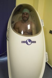 Ross Edgley in the 'Bodpod,' about to have his weight and body volume measured prior to the tiger challenge. (National Geographic/Bobby Cross)