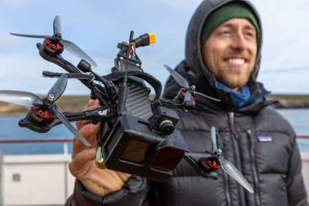 Drone Operator Raphael Boudreault-Simard holds one of his drones. (National Geographic for Disney/Ruth Davies)
