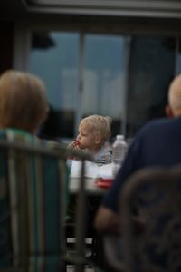Silas Pol, Charles and Beth's son, licks his fingers at the Pol family's barbecue. (National Geographic)