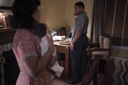 Coretta, played by Weruche Opia, watches as Martin, played by Kelvin Harrison Jr., answers the phone in GENIUS: MLK/X. (National Geographic/Richard DuCree)