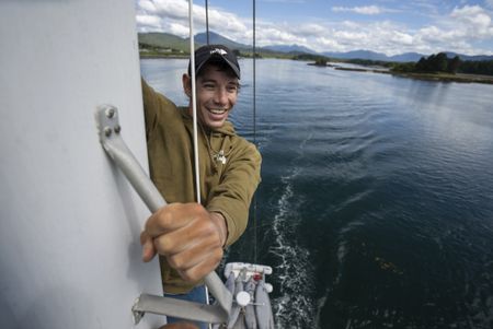 Alex Honnold climbing the mast of the sail boat whilst sailing through the Inside Passage.  (National Geographic/Taylor Shaffer)