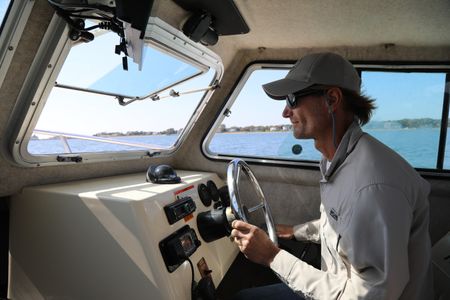 Greg Metzger driving his boat. (National Geographic/Mariana Kneppers)
