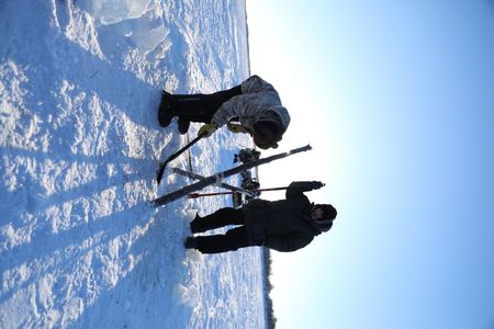 Brothers, Avery and Gage Hoffman set fish nets under the ice for subsistence food for their family and community. (BBC Studios Reality Productions, LLC/Isaiah Branch - Boyle)