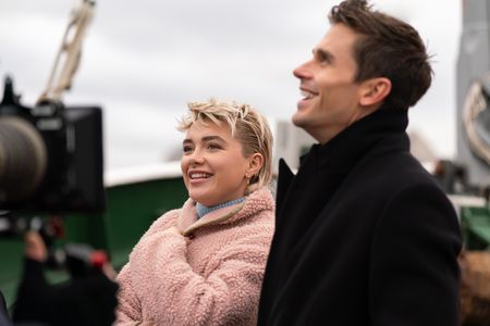 Florence Pugh and Antoni Porowski ride a boar on the Thames. (National Geographic/Chris Raphael)