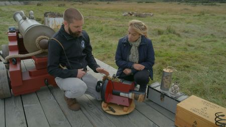 Weapons expert Rob Bibbings explains the firing mechanism of a Napoleonic era cannon. (National Geographic)